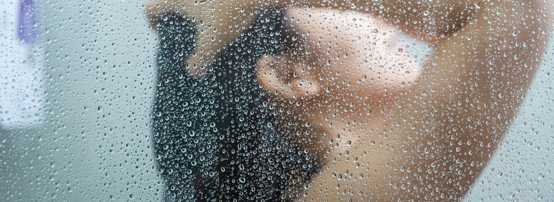 woman taking a hot shower after her work out using myni's non-toxic shower gel