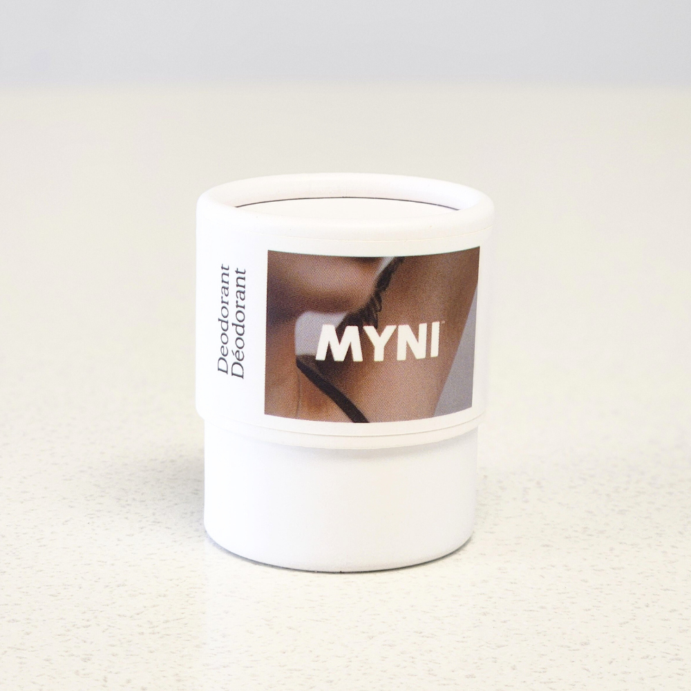 White deodorant container with 'MYNI' branding on a light gray background