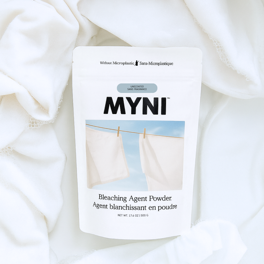 MYNI bleaching agent powder packaging on a white fabric background