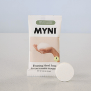 MYNI foaming hand soap bar with packaging on a light gray background