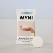 MYNI foaming hand soap packaging with a bar of soap on a light gray background
