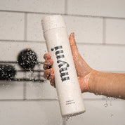 shampoo wheat straw bottle under shower water